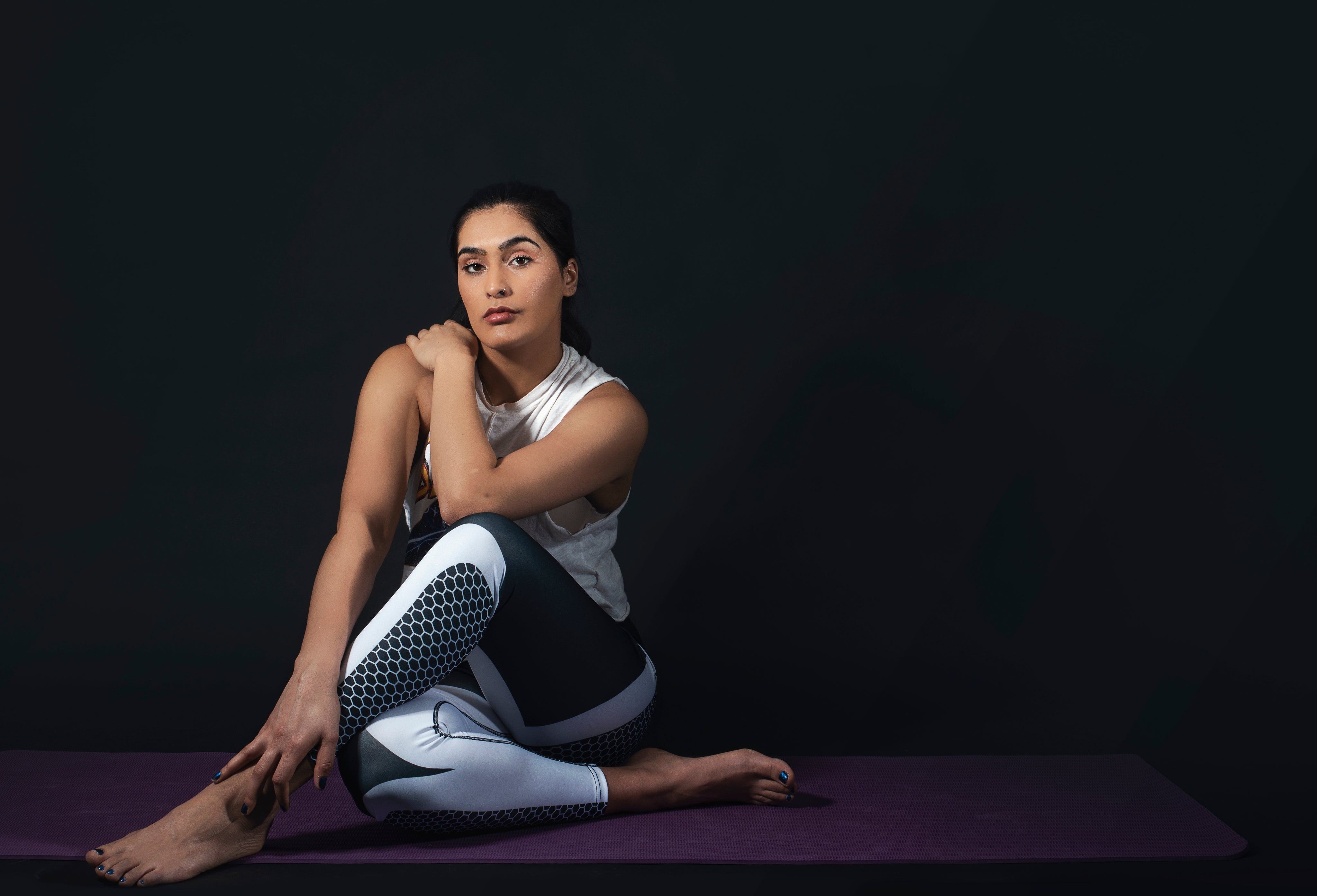woman-sits-in-yoga-pose.jpg